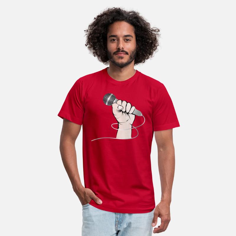 A hand of a singer holds a singing microphone