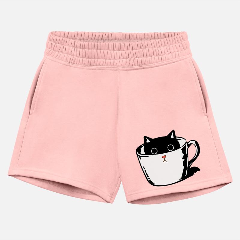 Black kitten with red nose hiding in a cup